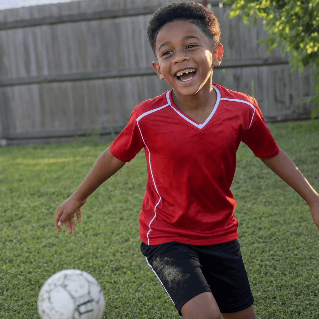 Malik's source photo in a red soccer jersey.